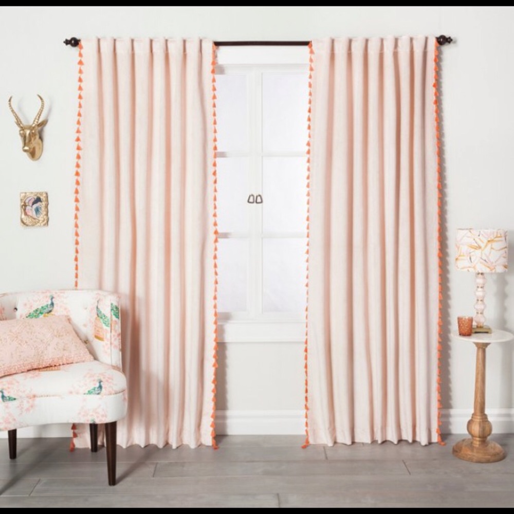 Target Opalhouse blush pink curtain panel with orange tassels. 54” wideX84” high
